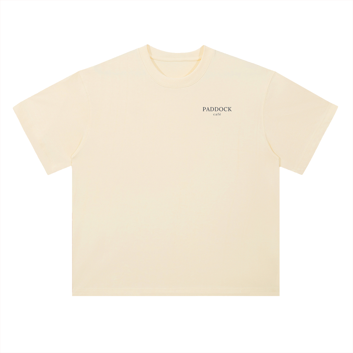 Paddock Café Racing Graphic T-Shirt in Milk Apricot, a relaxed-fit motorsport streetwear tee, front view: small Paddock wordmark on the chest